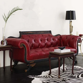 Триместен разтегателен диван в хола с конец от черния масив, дърво и кожа копчета